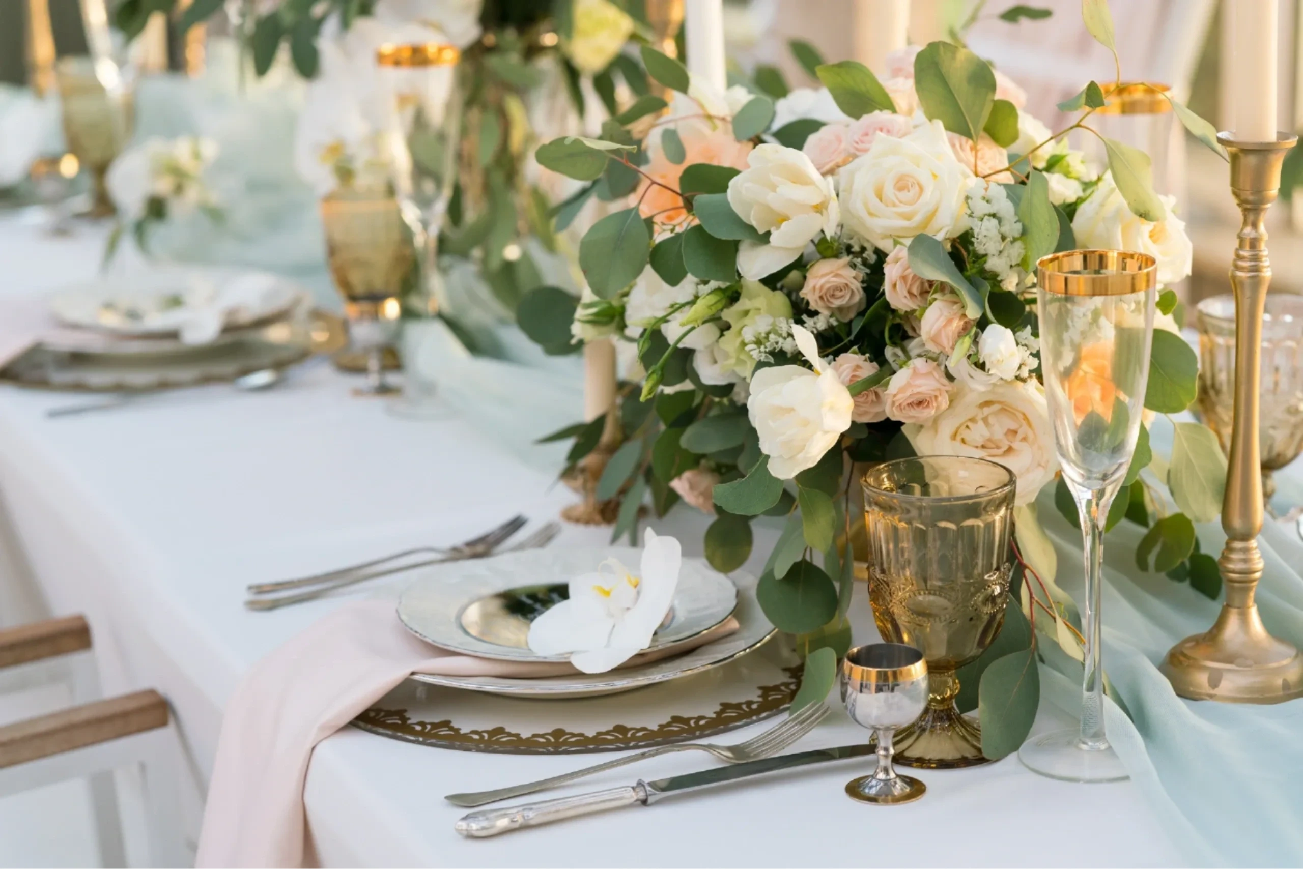 Elegantly decorated event table with flowers and place settings